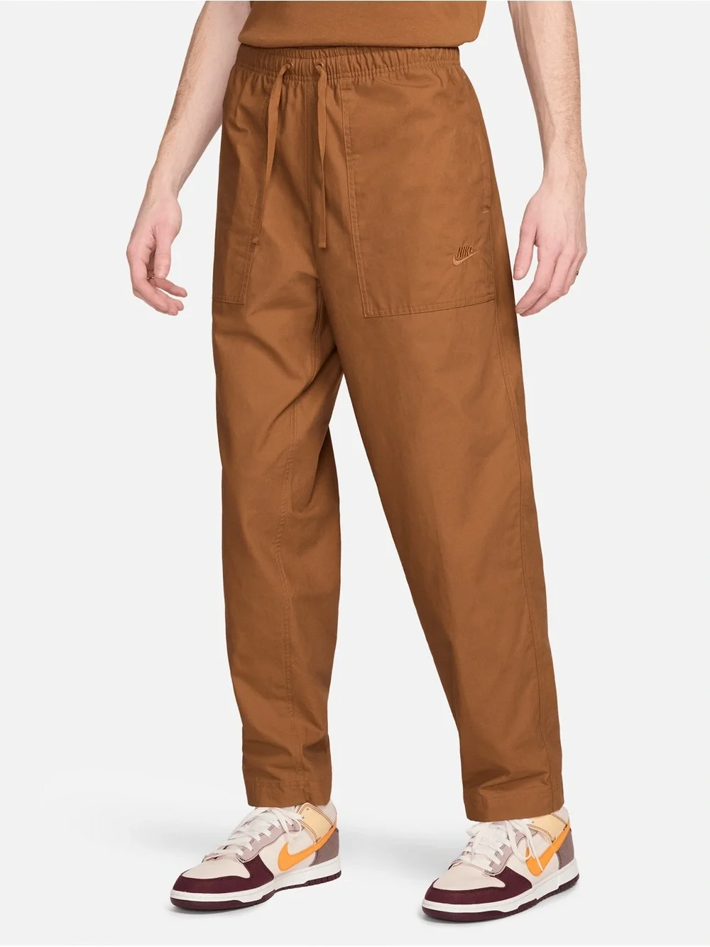 Nike loose fit tapered club pants size S